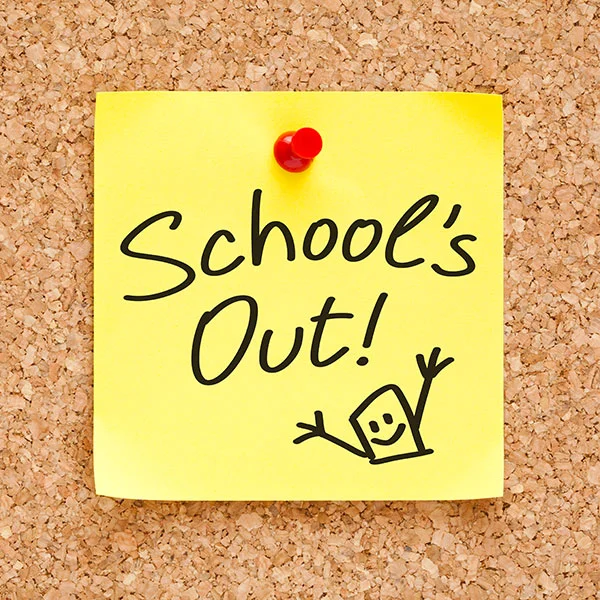 yellow sticky note pinned to a cork board. the stick note reads "School's Out!"