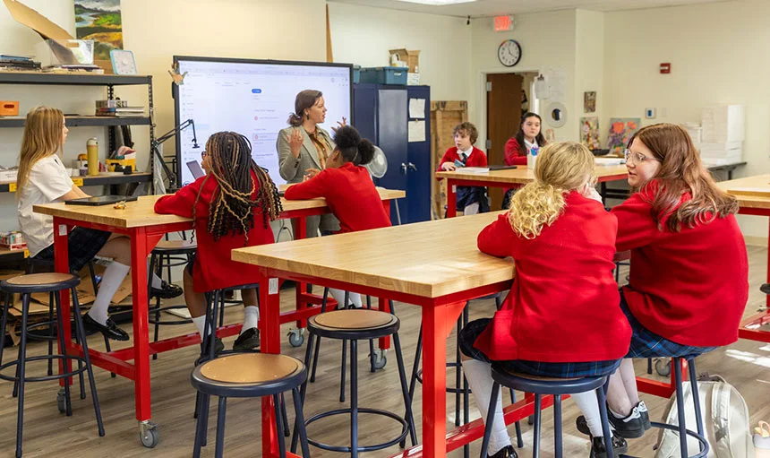 Students in class listening to the teacher