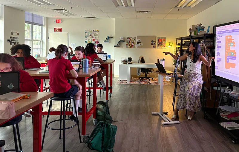 Teacher instructing her class at The Texas Girls School